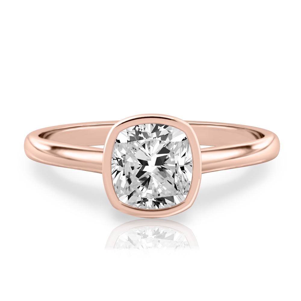 cushion cut diamond bezel engagement ring in rose gold