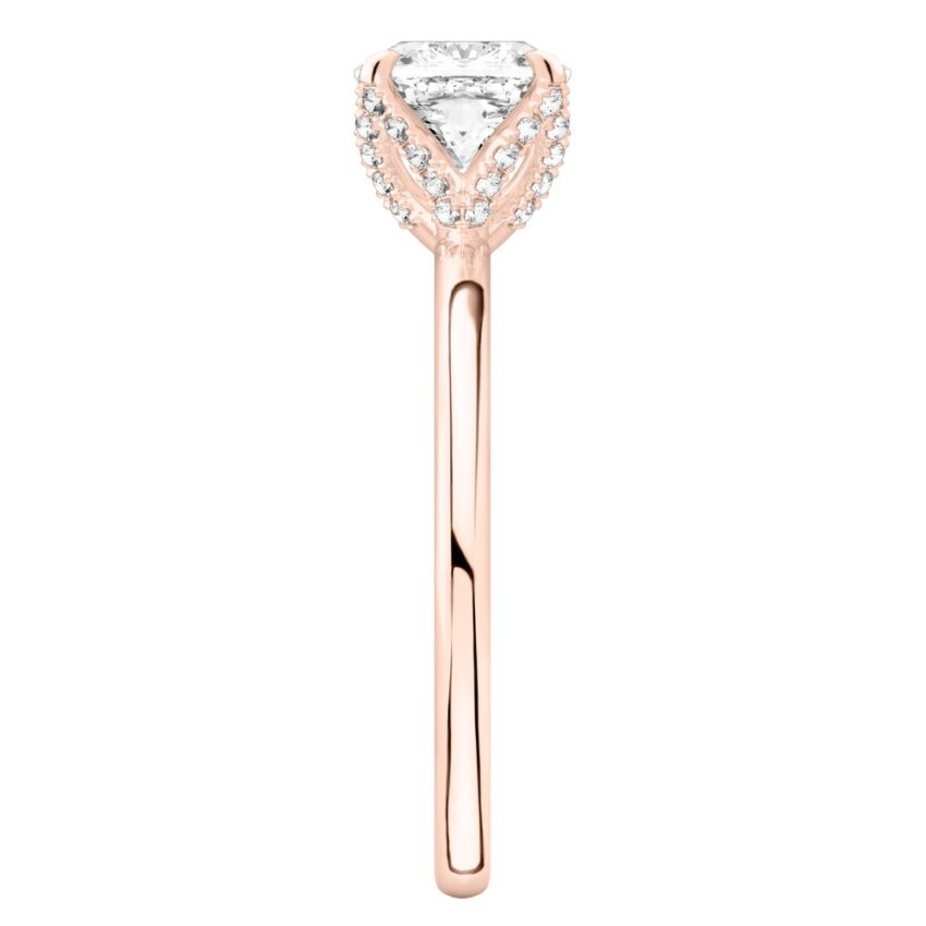 Side view of cushion cut diamond pave petal prong engagement ring in rose gold