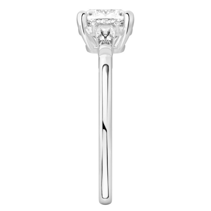 Side view of cushion cut diamond tapered baguette engagement ring in palladium