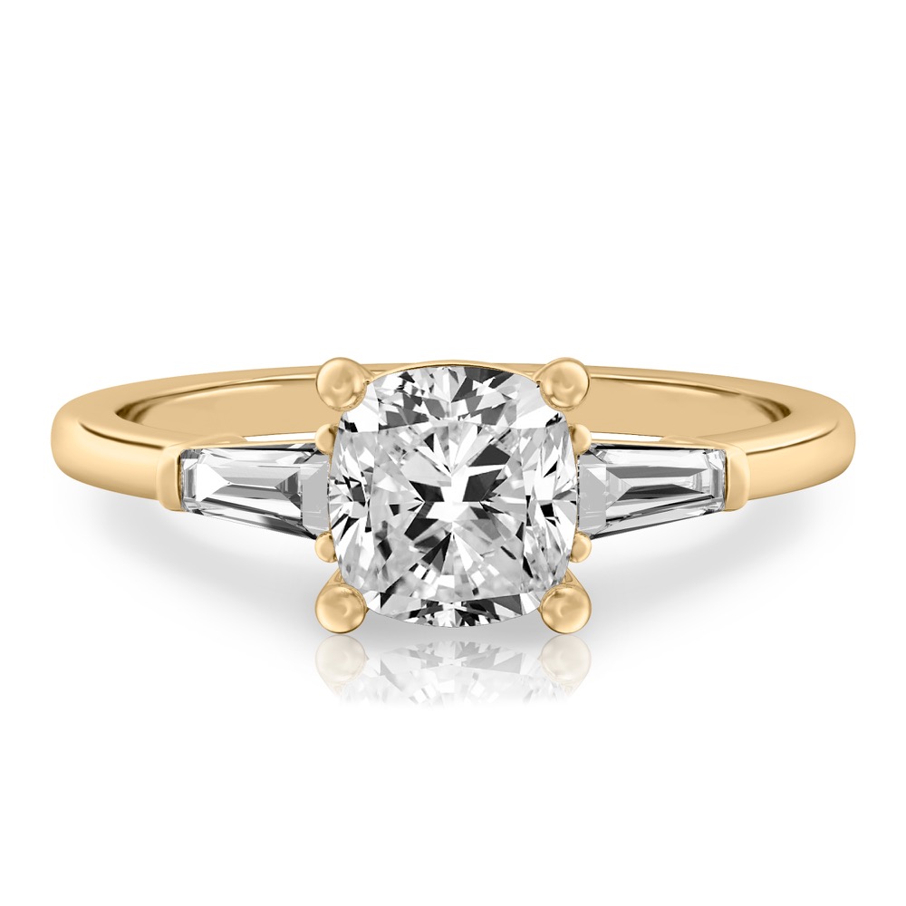 cushion cut diamond tapered baguette engagement ring in yellow gold