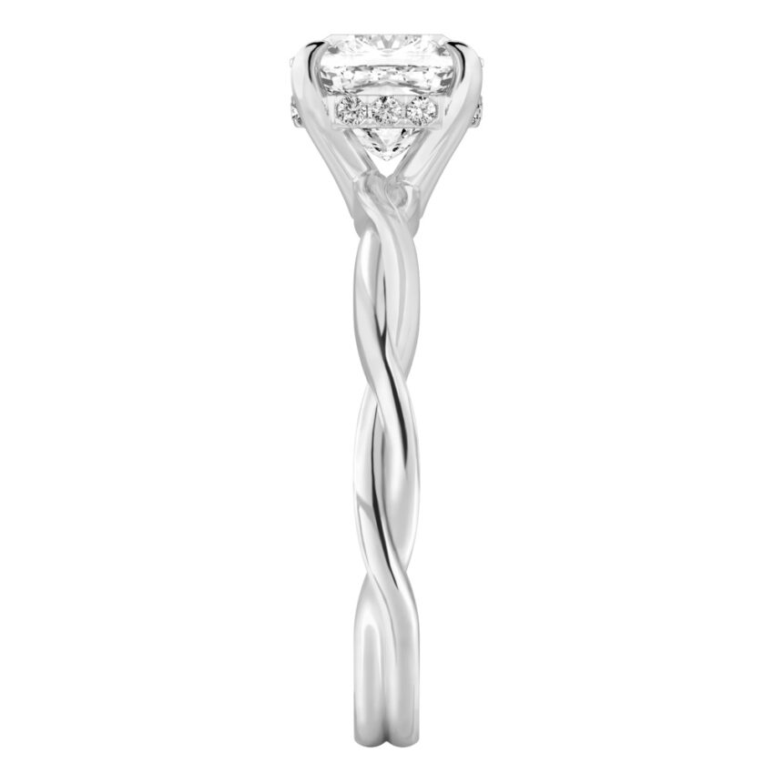 Side view of cushion cut diamond twisted hidden halo engagement ring in platinum