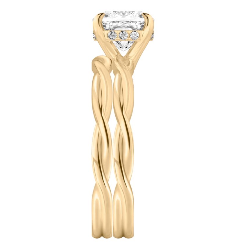 Side view of cushion cut diamond twisted hidden halo engagement ring set yellow gold