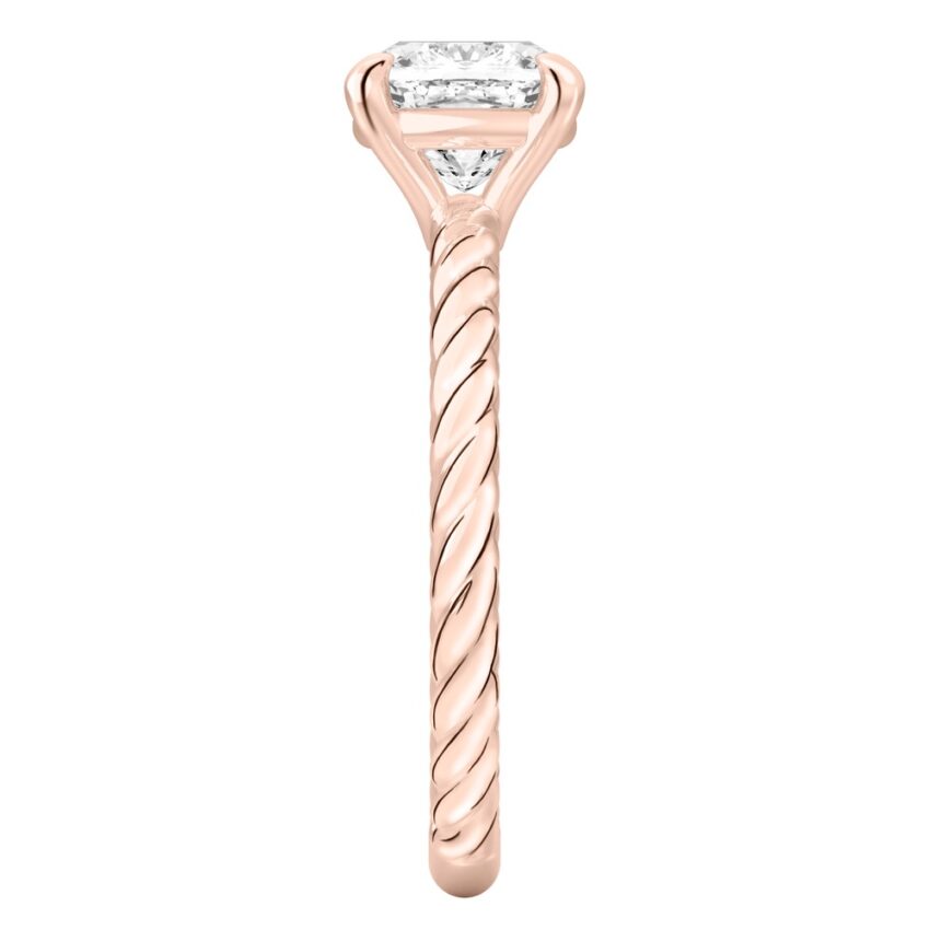 Side view of cushion cut diamond twisted rope engagement ring in rose gold