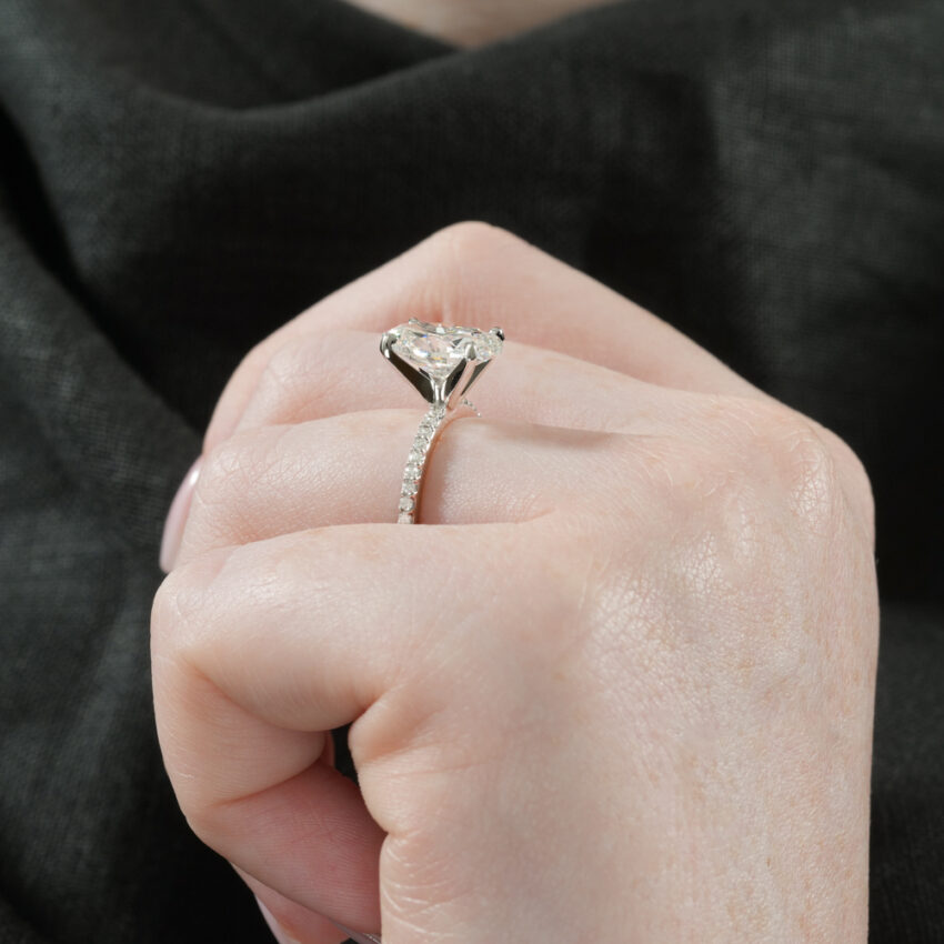 Angle view of dainty engagement ring in lifestyle