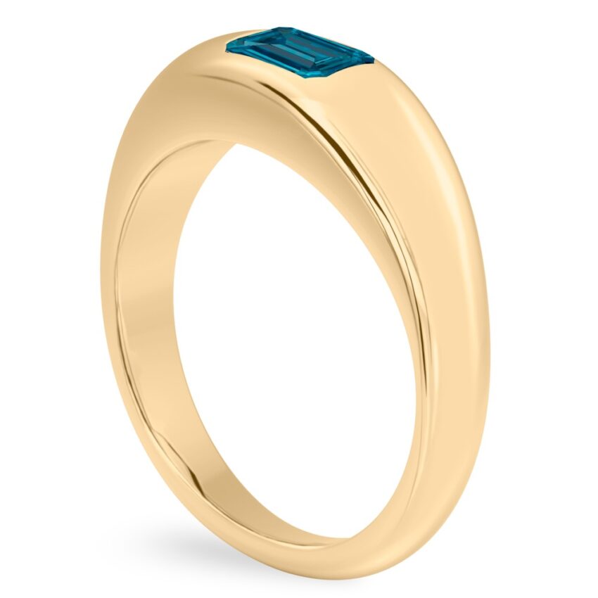Angle view of emerald cut december birthstone dome ring yellow gold
