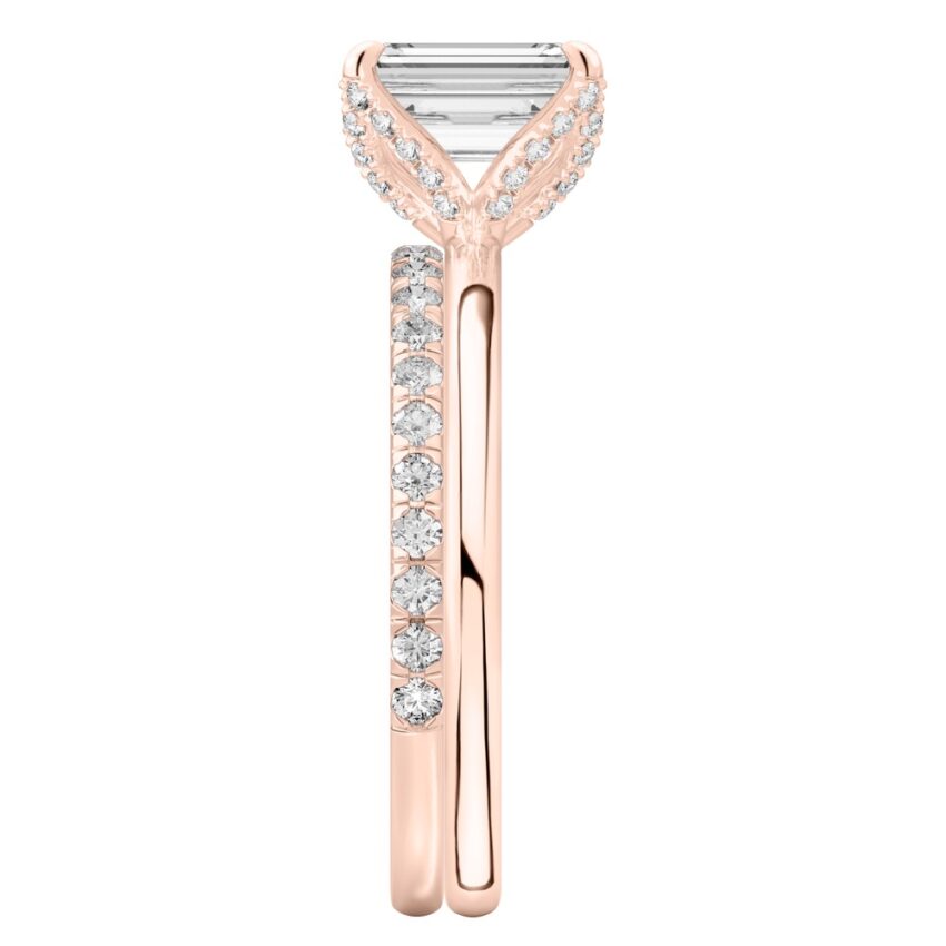 Side view of emerald cut diamond pave petal prong engagement ring set rose gold