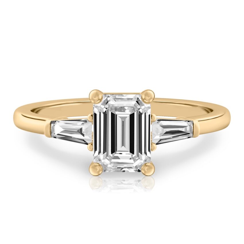 emerald cut diamond tapered baguette engagement ring in yellow gold