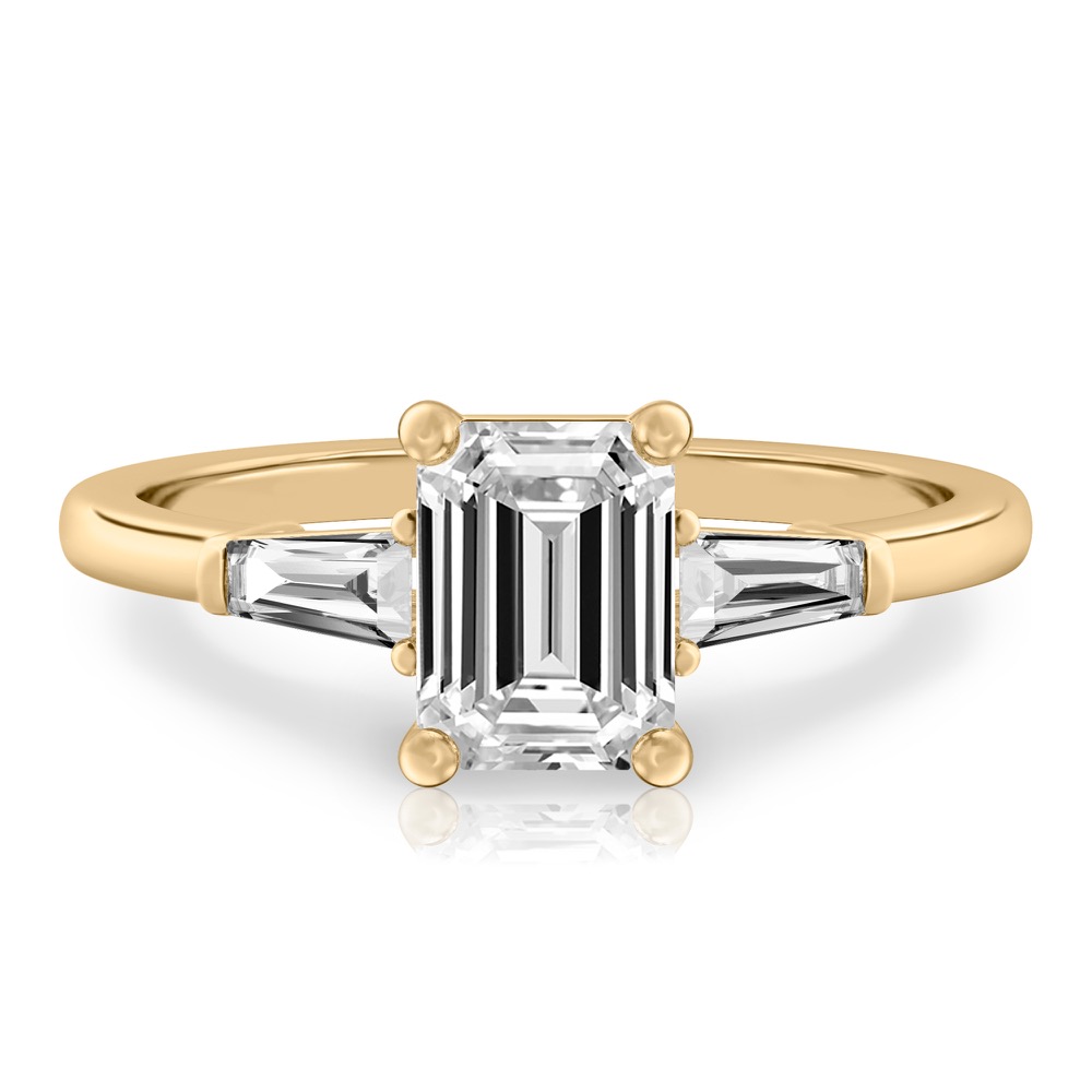 emerald cut diamond tapered baguette engagement ring in yellow gold