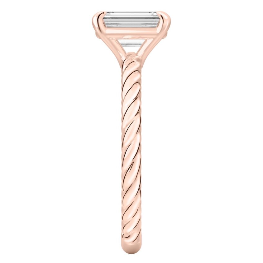 Side view of emerald cut diamond twisted rope engagement ring in rose gold