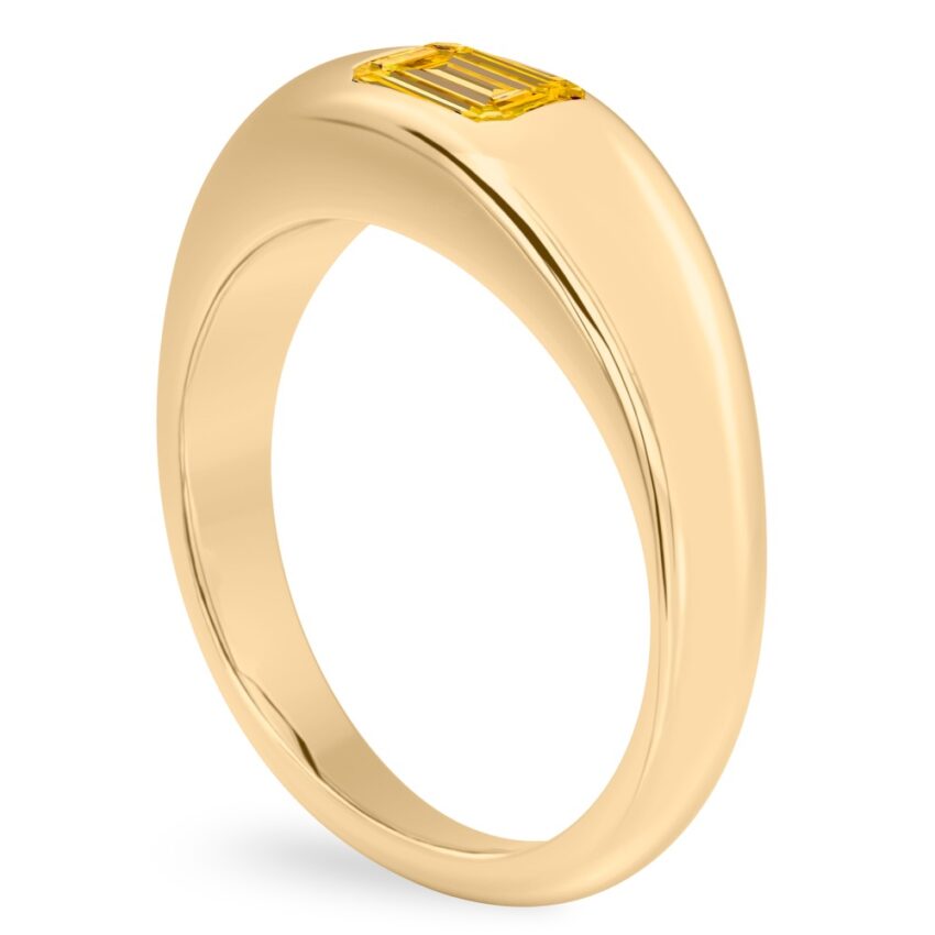 Angle view of emerald cut november birthstone dome ring yellow gold