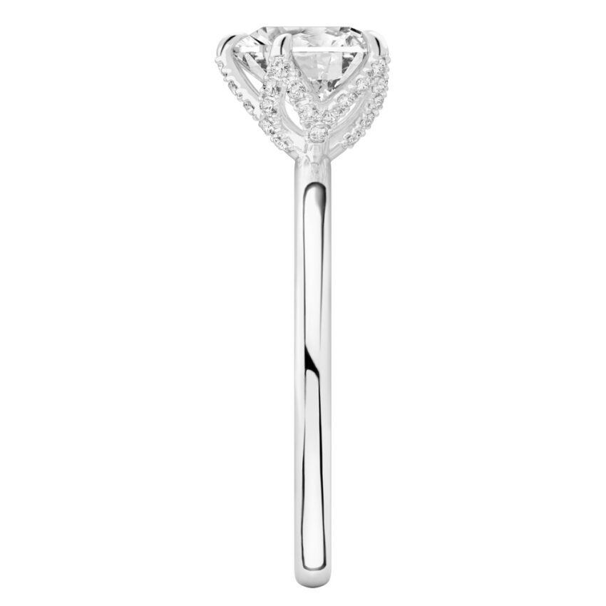 Side view of heart shape diamond pave petal prong engagement ring in platinum