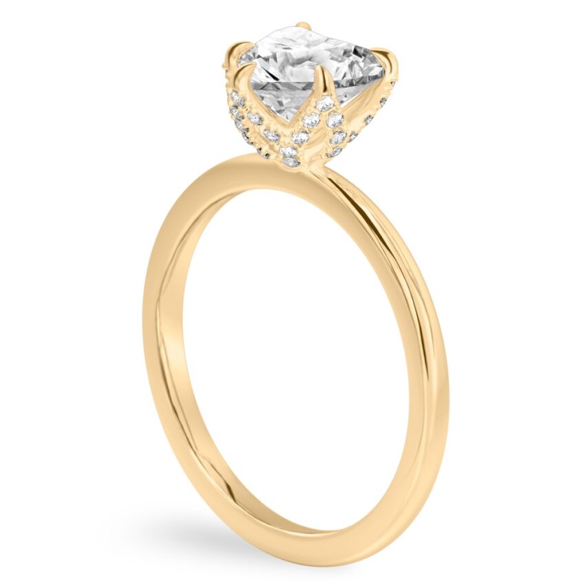 Angle view of heart shape diamond pave petal prong engagement ring in yellow gold