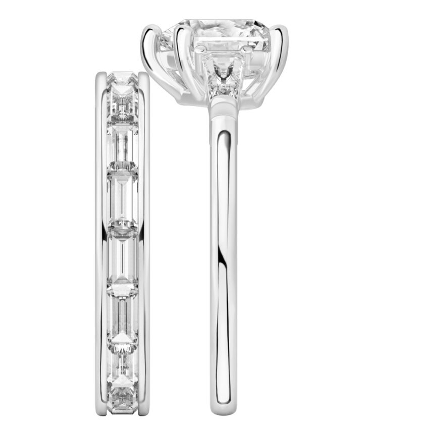 Side view of heart shape diamond tapered baguette engagement ring set palladium