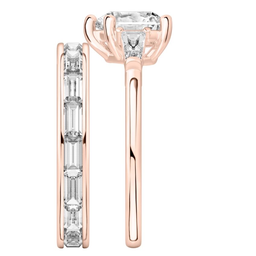 Side view of heart shape diamond tapered baguette engagement ring set rose gold