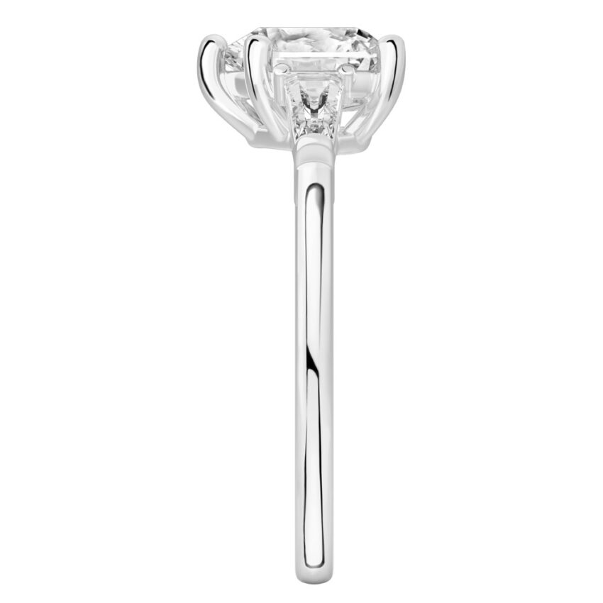 Side view of heart shape diamond tapered baguette engagement ring in white gold