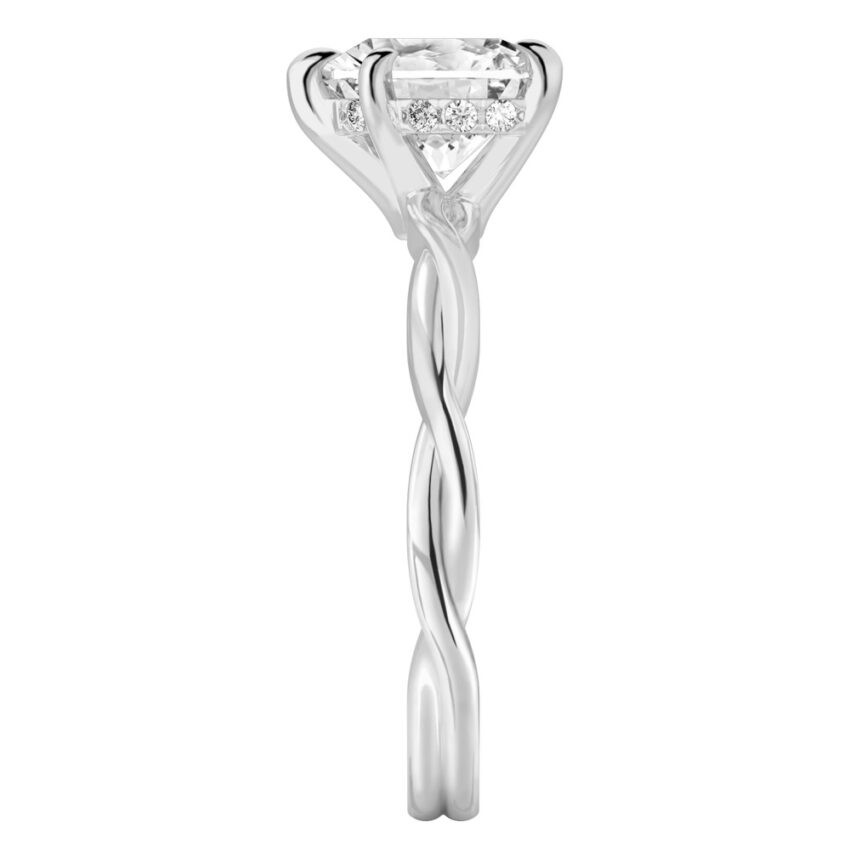 Side view of heart shape diamond twisted hidden halo engagement ring in platinum