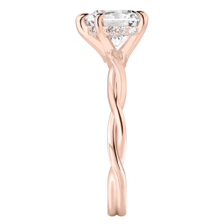 Side view of heart shape diamond twisted hidden halo engagement ring in rose gold