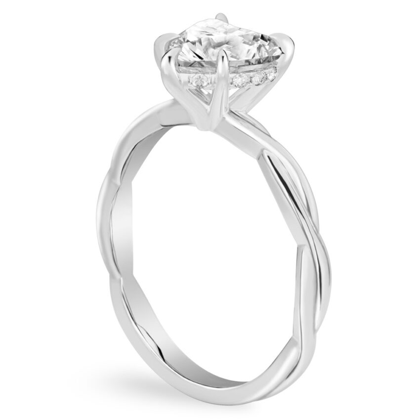 Angle view of heart shape diamond twisted hidden halo engagement ring in white gold