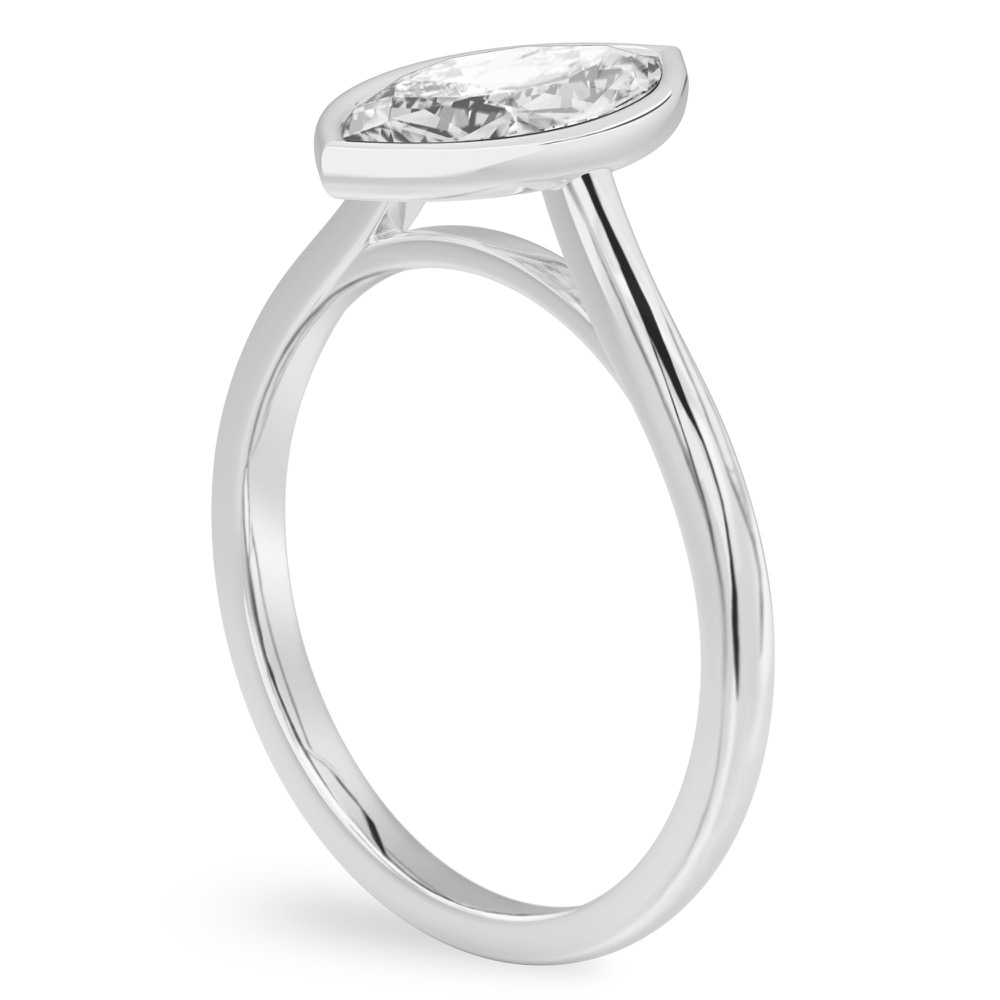 Angle view of marquise cut diamond bezel engagement ring in white gold