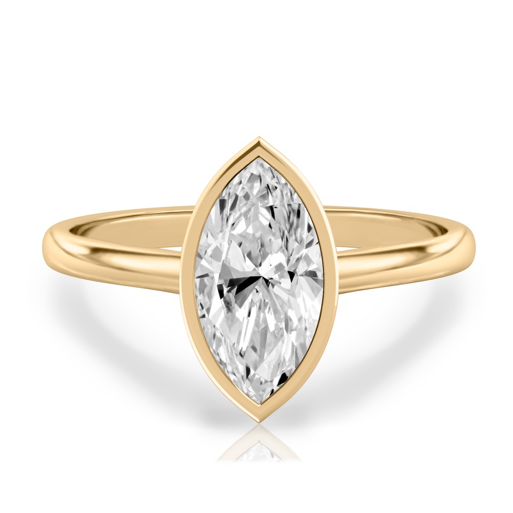 marquise cut diamond bezel engagement ring in yellow gold