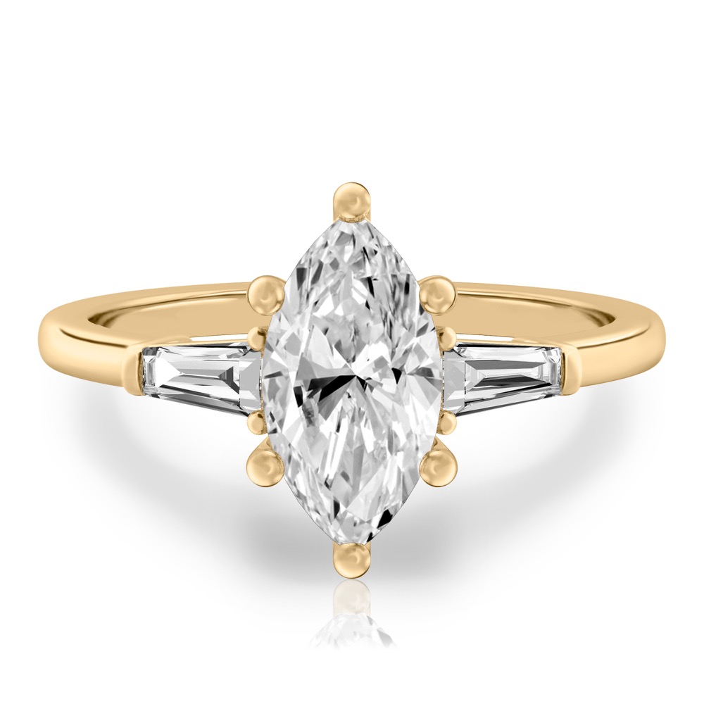 marquise cut diamond tapered baguette engagement ring in yellow gold