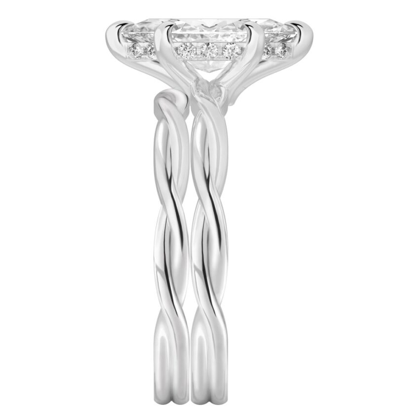 Side view of marquise cut diamond twisted hidden halo engagement ring set platinum