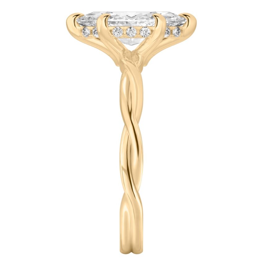 Side view of marquise cut diamond twisted hidden halo engagement ring in yellow gold