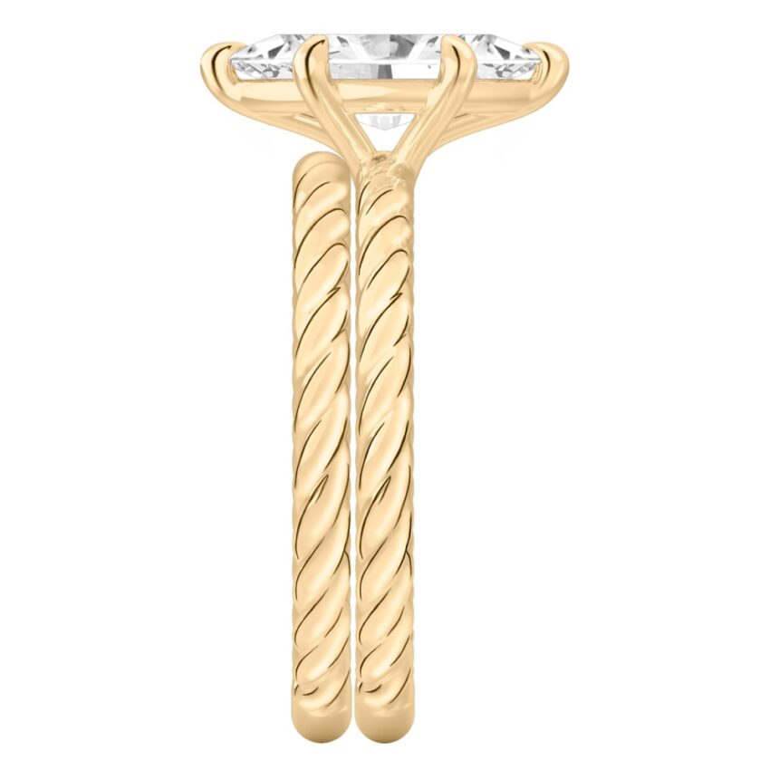 Side view of marquise cut diamond twisted rope engagement ring set yellow gold