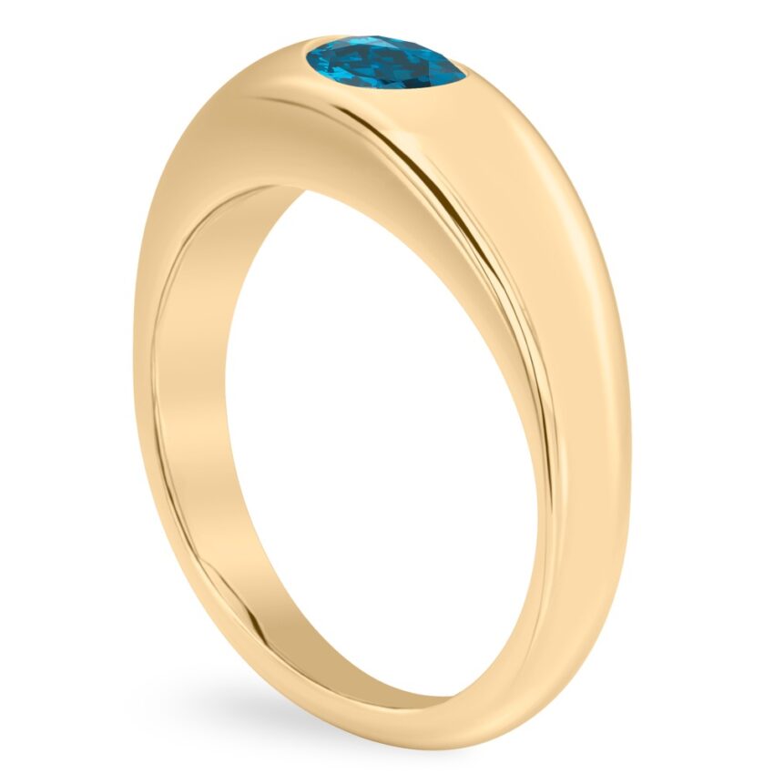Angle view of oval shape december birthstone dome ring yellow gold
