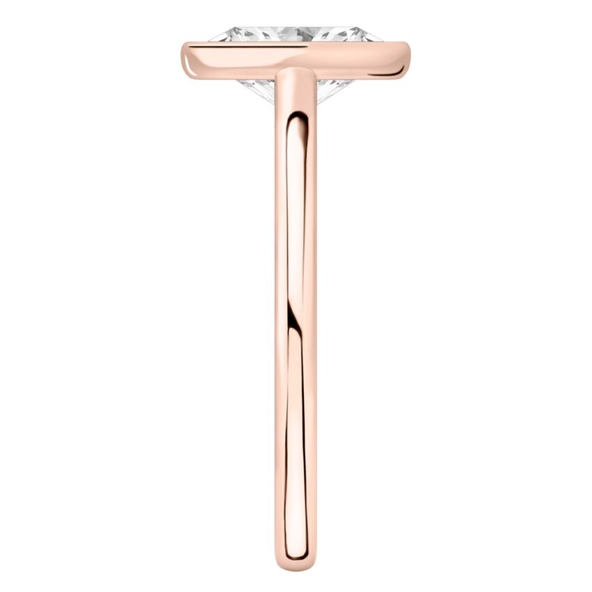 Side view of oval shape diamond bezel engagement ring in rose gold