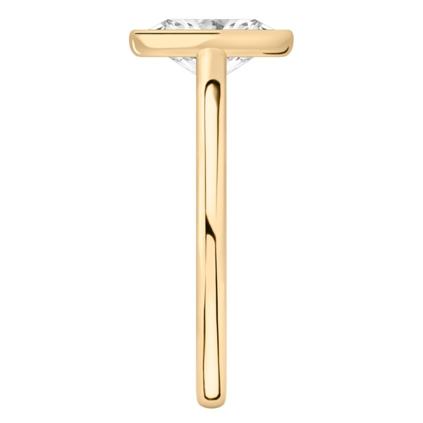 Side view of oval shape diamond bezel engagement ring in yellow gold