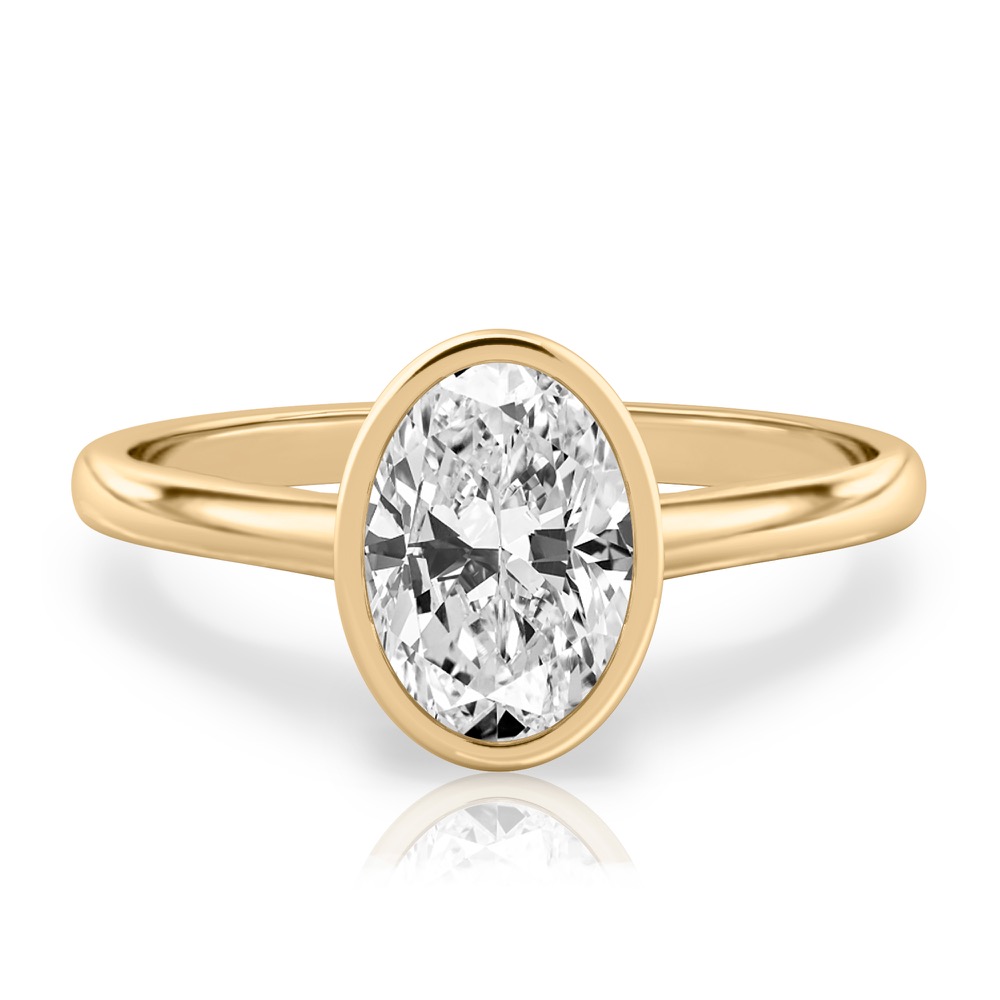 oval shape diamond bezel engagement ring in yellow gold