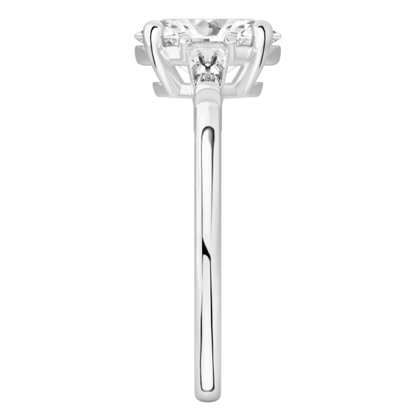 Side view of oval shape diamond tapered baguette engagement ring in palladium