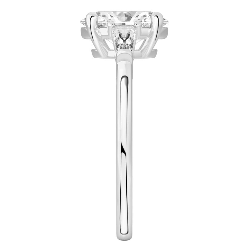 Side view of oval shape diamond tapered baguette engagement ring in platinum