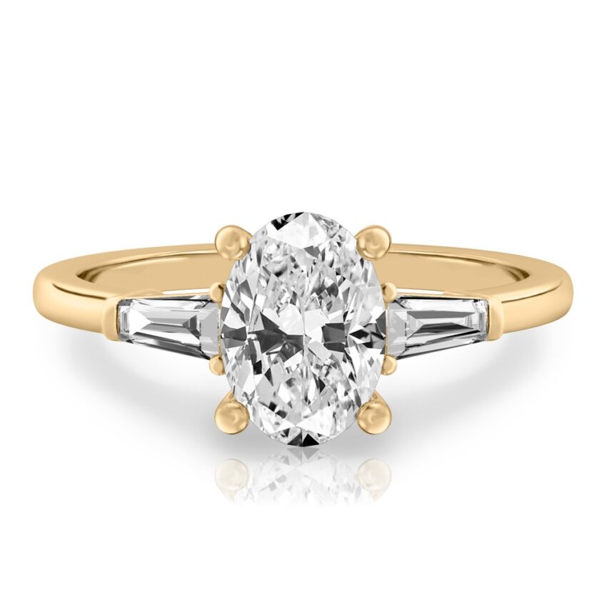 oval shape diamond tapered baguette engagement ring in yellow gold