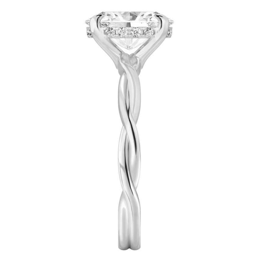 Side view of oval shape diamond twisted hidden halo engagement ring in platinum