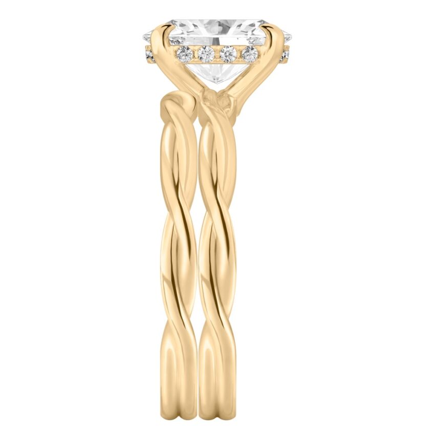 Side view of oval shape diamond twisted hidden halo engagement ring set yellow gold