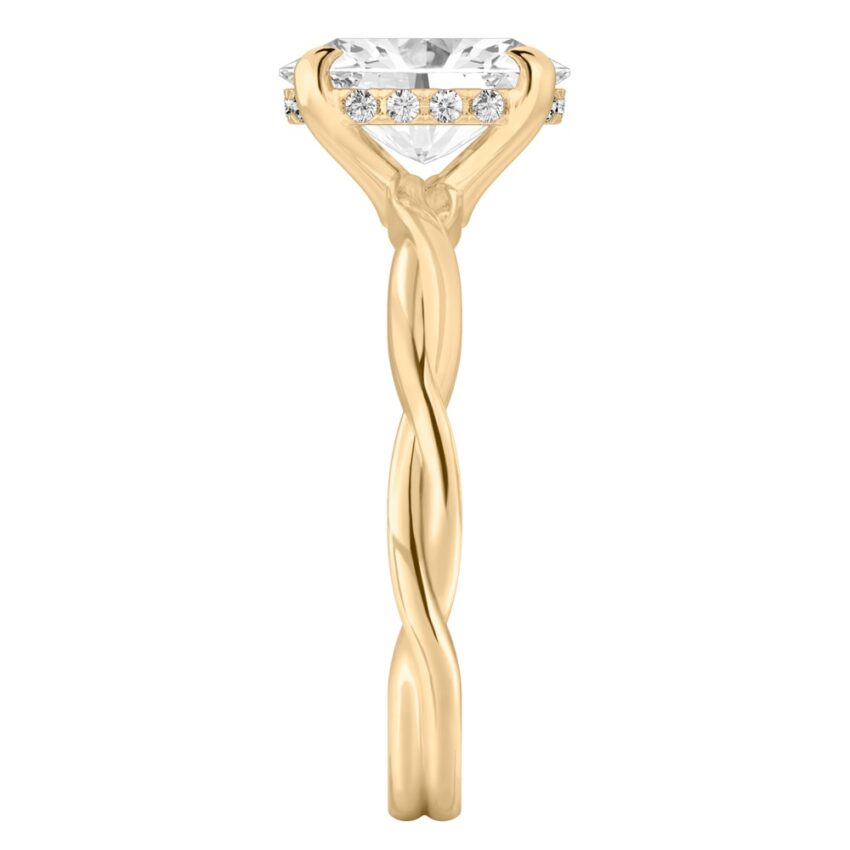 Side view of oval shape diamond twisted hidden halo engagement ring in yellow gold