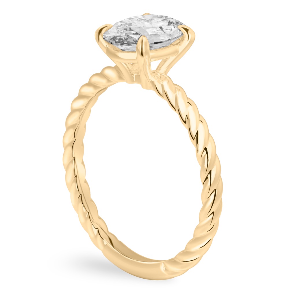 Angle view of oval shape diamond twisted rope engagement ring in yellow gold