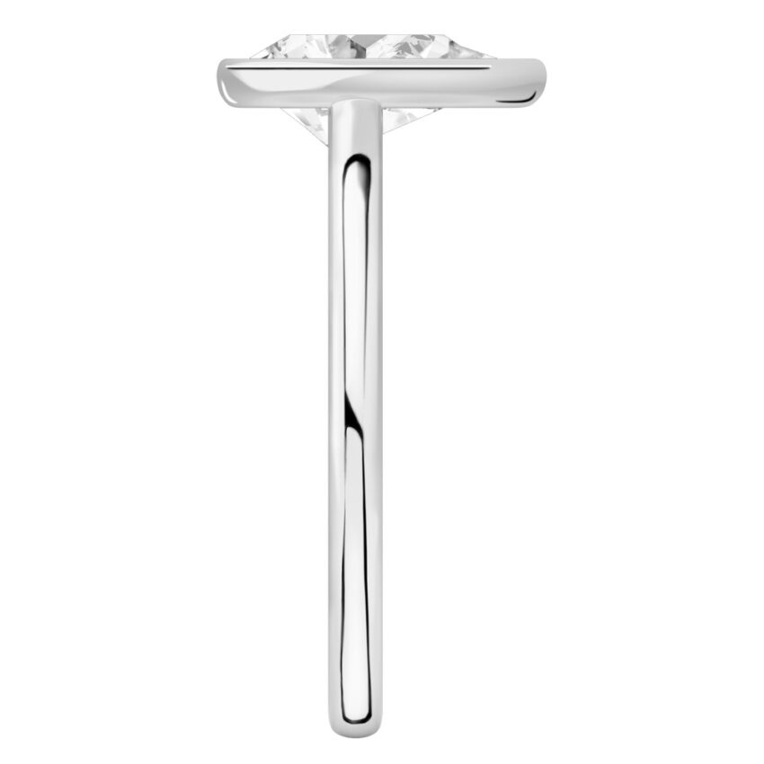 Side view of pear shape diamond bezel engagement ring in palladium