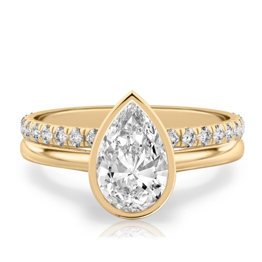 pear shape diamond bezel engagement ring set yellow gold