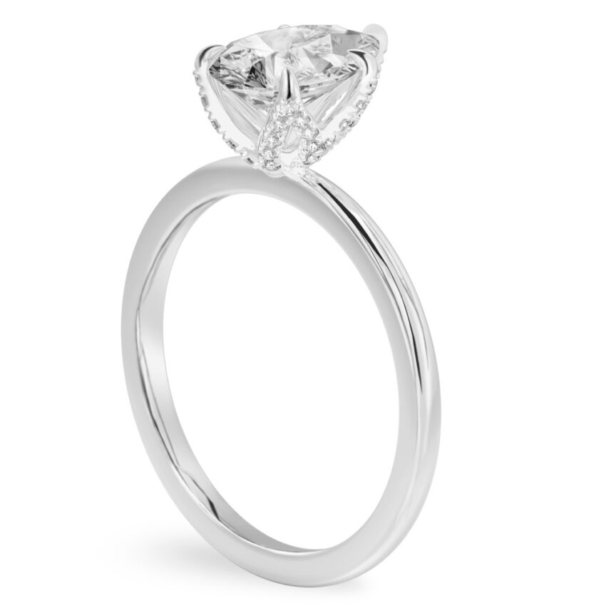 Angle view of pear shape diamond pave petal prong engagement ring in palladium