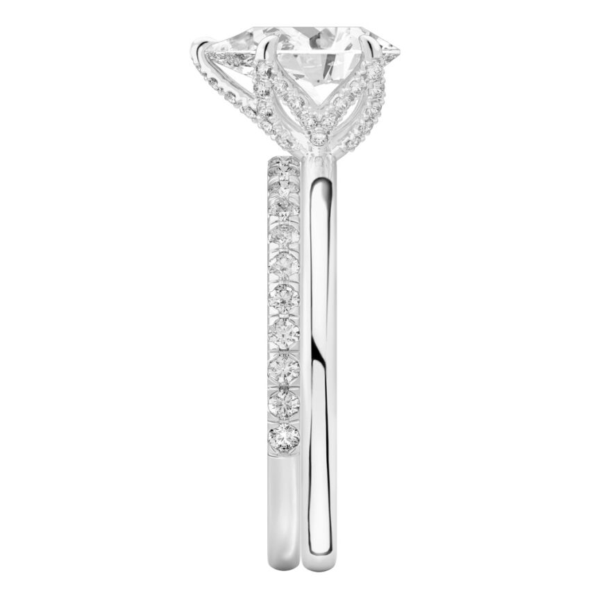 Side view of pear shape diamond pave petal prong engagement ring set palladium