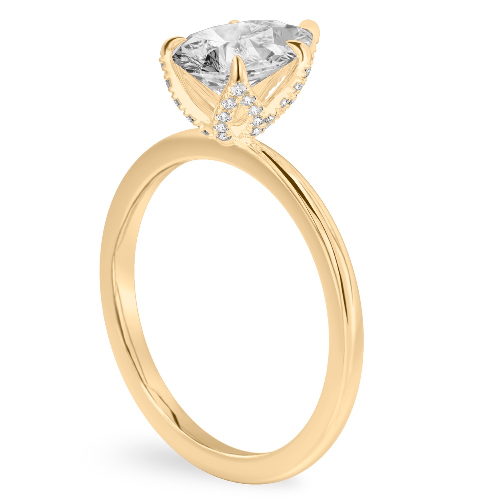 Angle view of pear shape diamond pave petal prong engagement ring in yellow gold