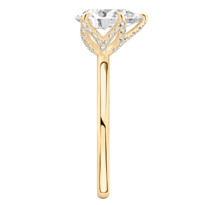 Side view of pear shape diamond pave petal prong engagement ring in yellow gold