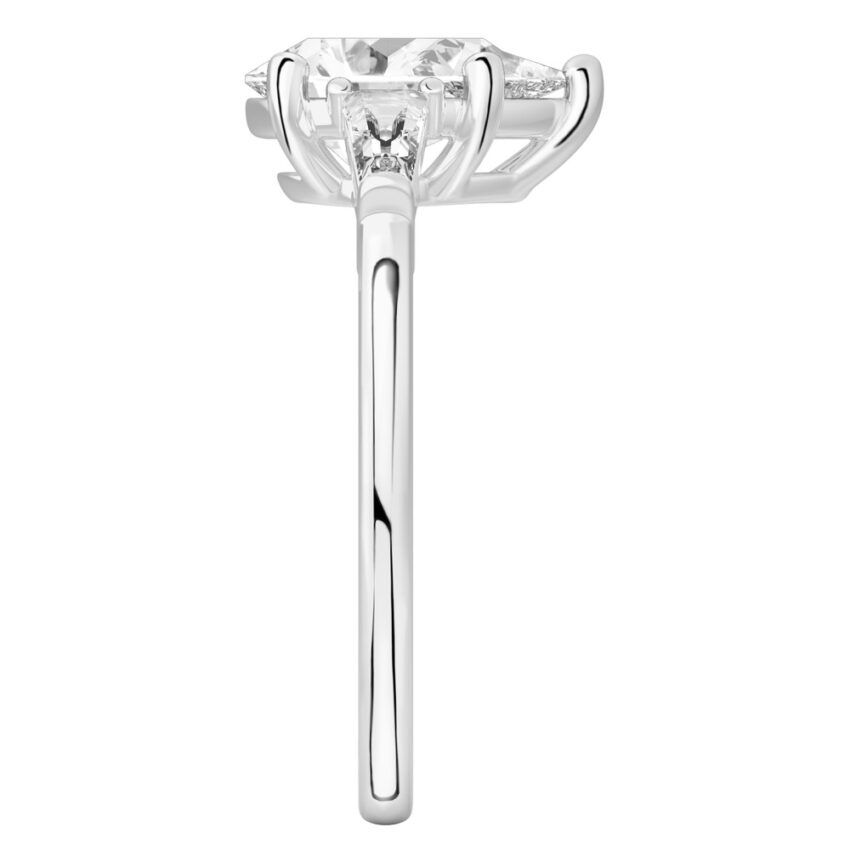 Side view of pear shape diamond tapered baguette engagement ring in platinum