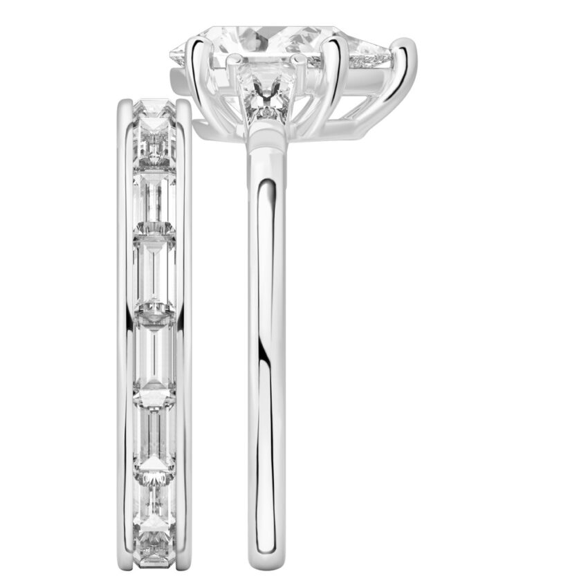 Side view of pear shape diamond tapered baguette engagement ring set platinum