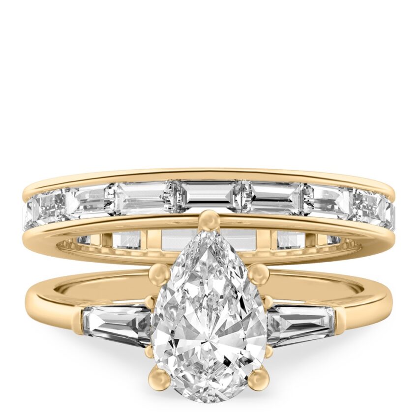 pear shape diamond tapered baguette engagement ring set yellow gold