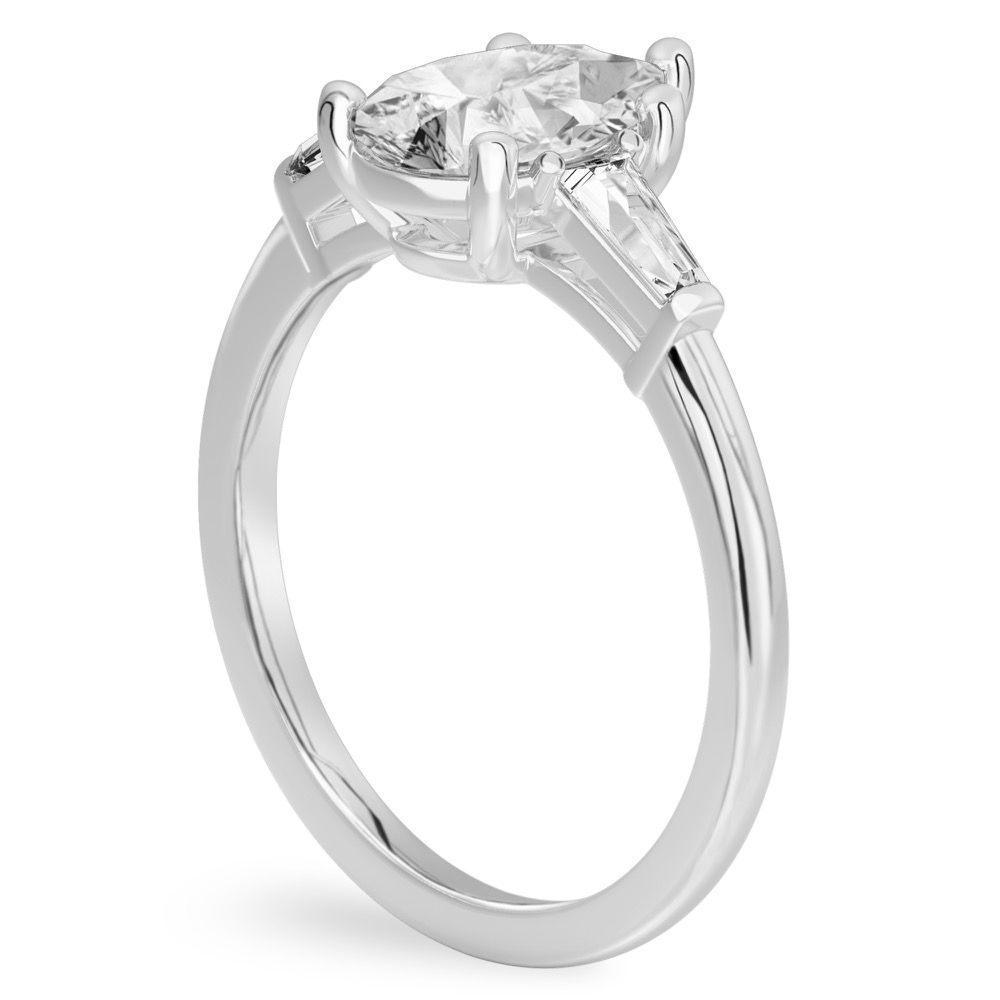 Angle view of pear shape diamond tapered baguette engagement ring in white gold