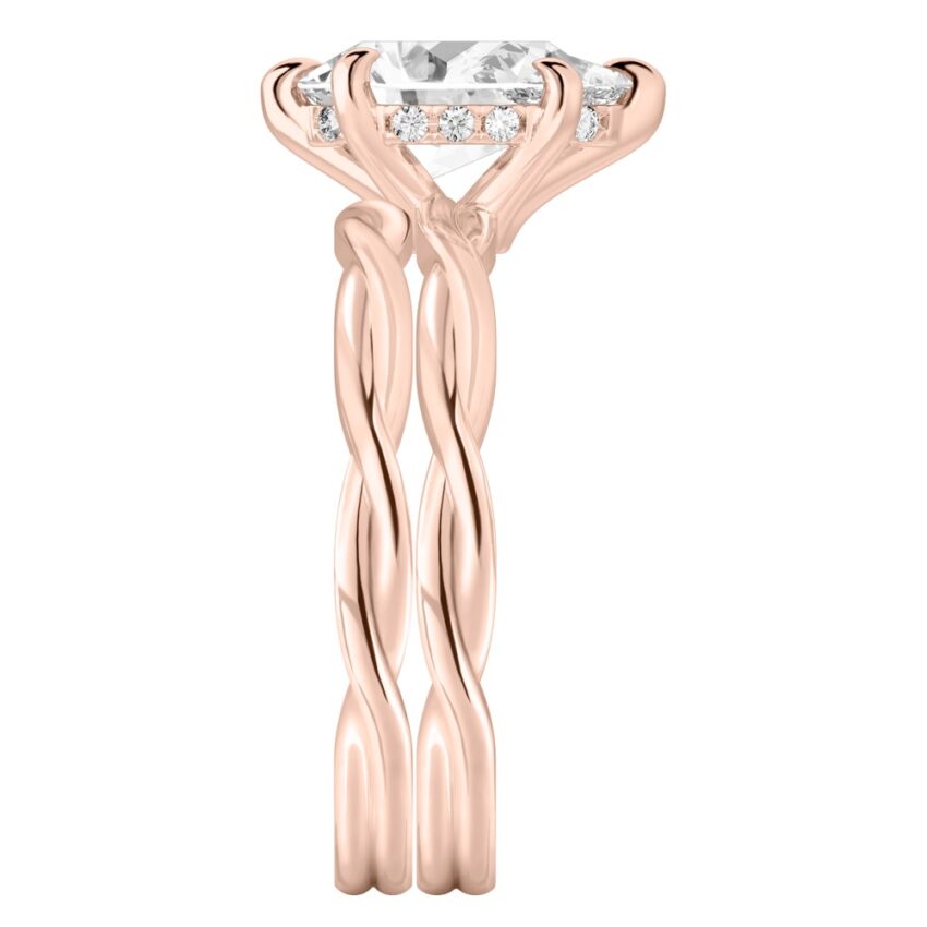 Side view of pear shape diamond twisted hidden halo engagement ring set rose gold